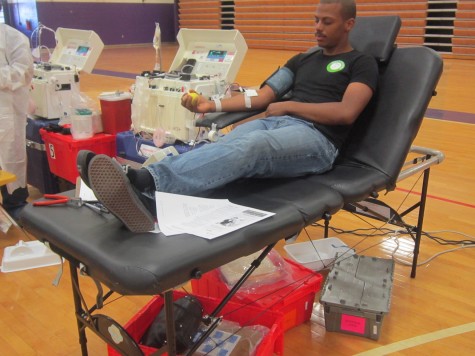 Senior Deshawn Howard gets his blood pressure taken by a volunteer nurse before donating blood.