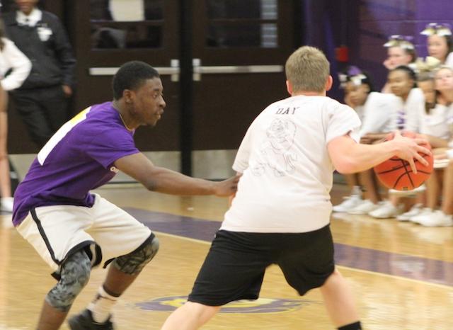 Shemar Butts defends against Patrick Day as he tries to get the faculty back into the game. 
