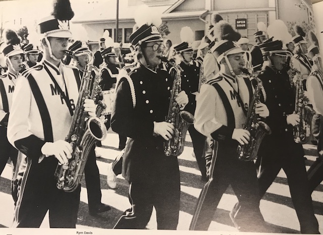 Circa 1992, Combined bands of Menchville and Denbigh march in the Patrick Henry Santa Parade as they play a Christmas song.