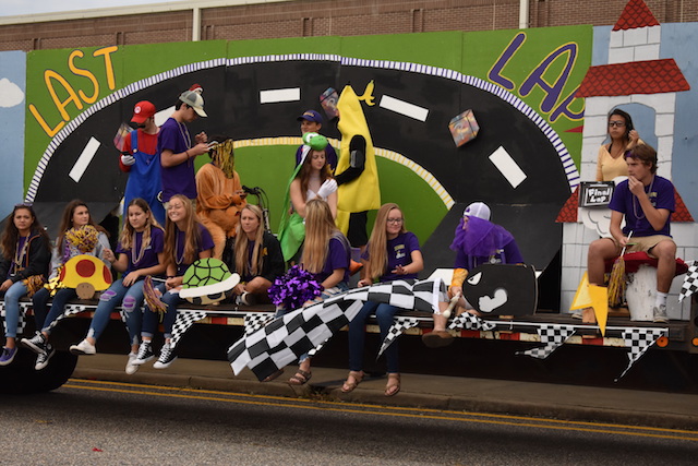 The Seniors hang out on their MarioCart themed float for Menchvilles annual Homecoming Parade.