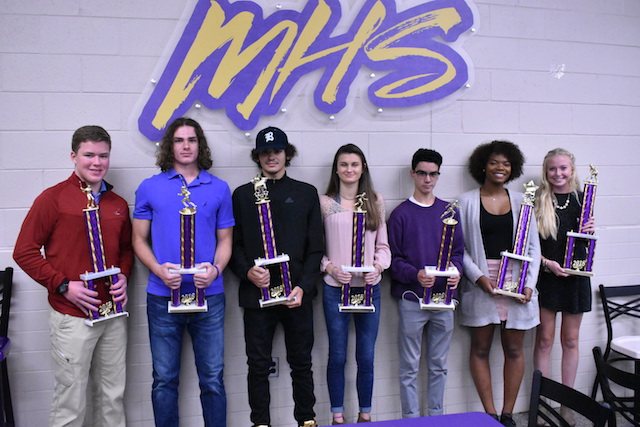 The awarded seniors standing with their trophies at the Fall Sports Banquet.