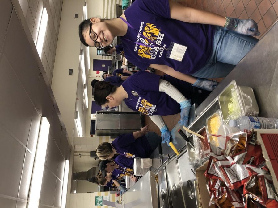 Volunteers helping out in the kitchen during Clash of Choirs