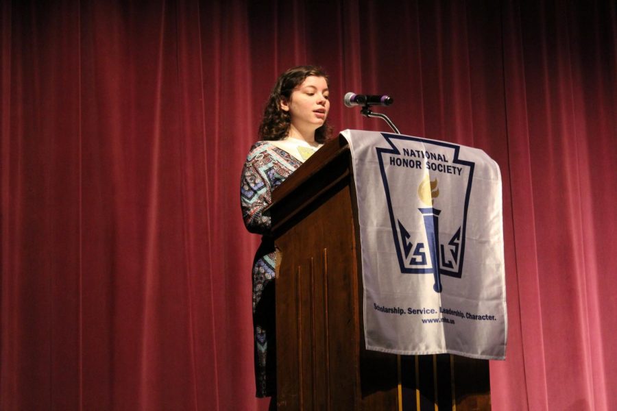 National Honor Society member Isabella Heller delivers a speech at the National Honor Society induction.