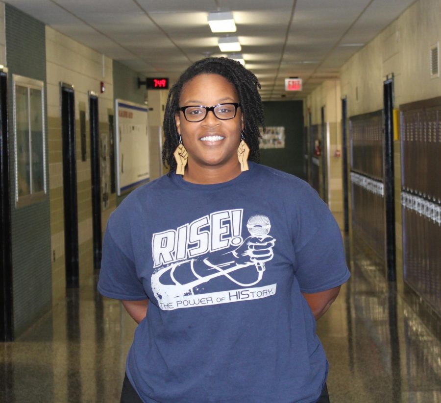 Director of Fooball Operations, Mrs. Graham, poses for a photo in the Menchville hall.